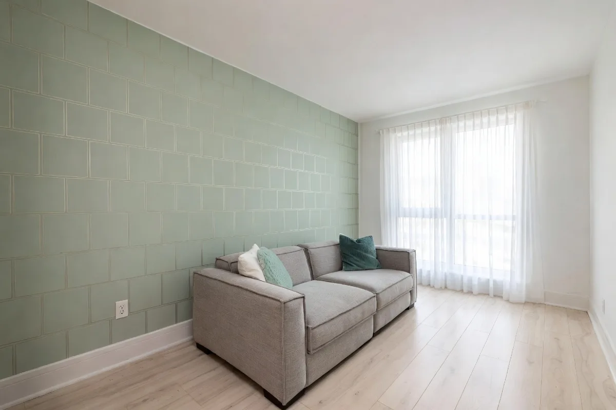 Renter-friendly small apartment living room with removable wallpaper accent wall and damage-free decor ideas