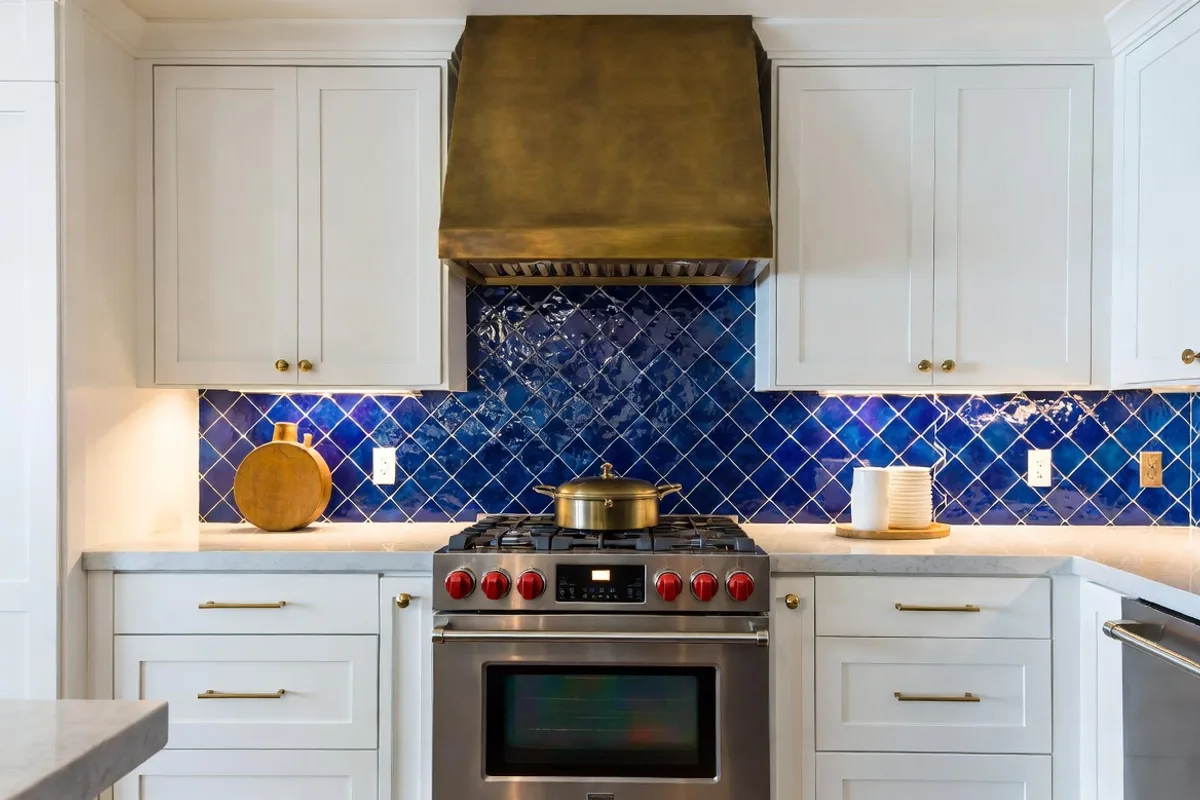 Cobalt blue zellige tile backsplash with white kitchen cabinets